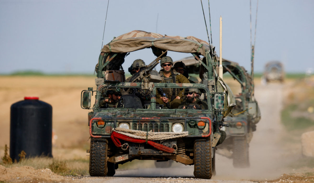 Soldiers sit in a military vehicle near the Israel-Gaza border, amid the ongoing conflict between Israel and the Palestinian Islamist group Hamas, in Israel, January 24, 2024. (REUTERS)