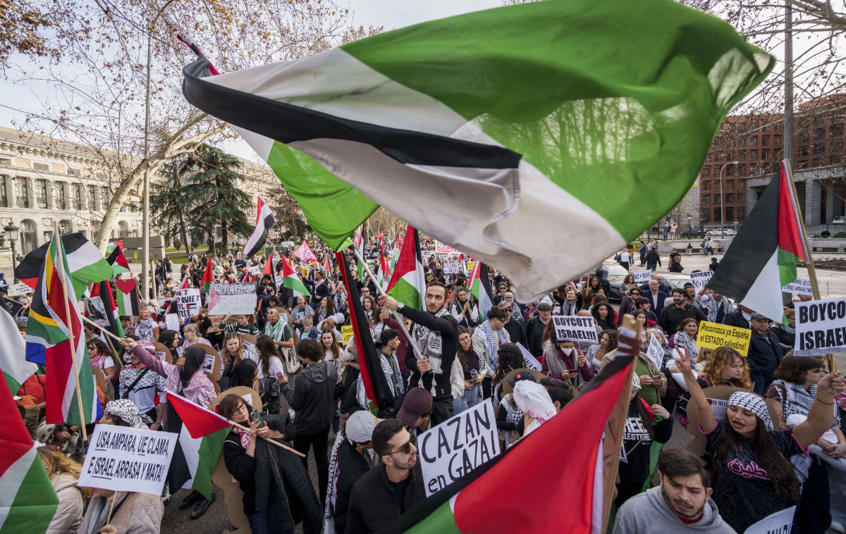 People march during a protest in support of Palestinians and calling for an immediate ceasefire in Gaza in downtown Madrid, Spain, Saturday, Jan. 27, 2024. (AP)