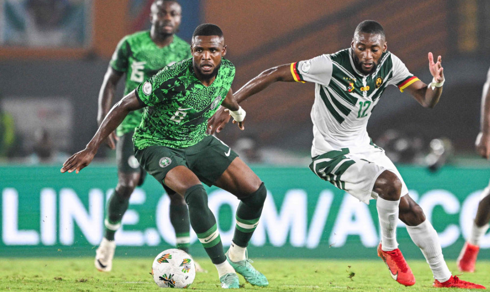 Nigeria's midfielder Frank Onyeka (L) fights for the ball with Cameroon's forward Karl Toko Ekambi during the Africa Cup of Nations (CAN) 2024 round of 16 football match between Nigeria and Cameroon at the Felix Houphouet-Boigny Stadium in Abidjan on January 27, 2024. (AFP)
