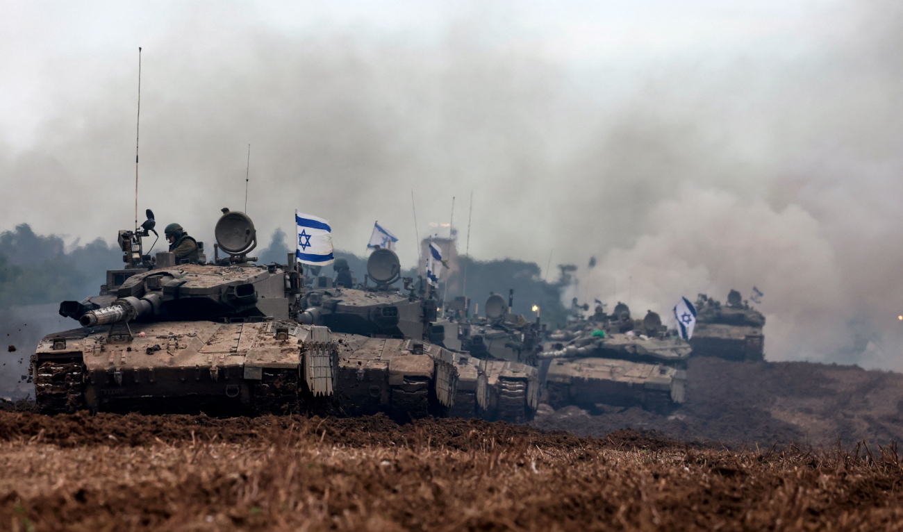 A unit of Israeli soldiers return with their tanks to the Israeli side of the border with the Gaza Strip, on January 28, 2024. (AFP/File)
