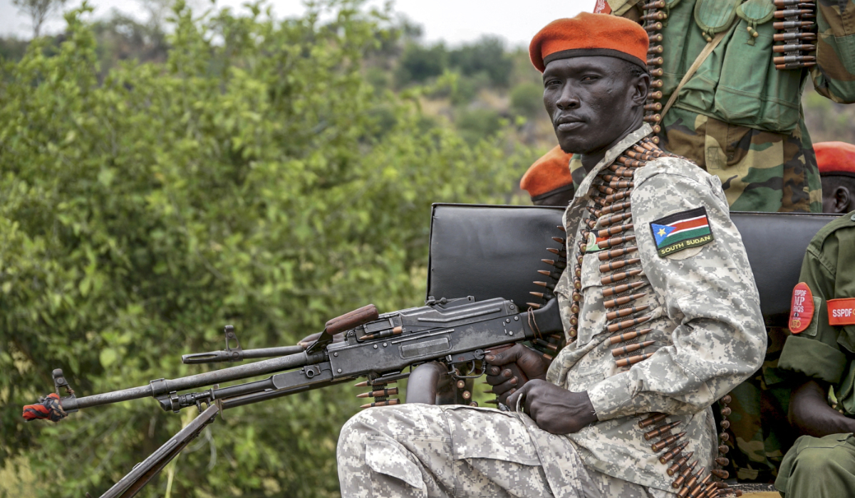 A South Sudanese military police officer sits on a pickup truck while monitoring the area as troops belonging to the South Sudanese Unified Forces take part in a deployment ceremony at the Luri Military Training Centre in Juba on November 15, 2023. (AFP)