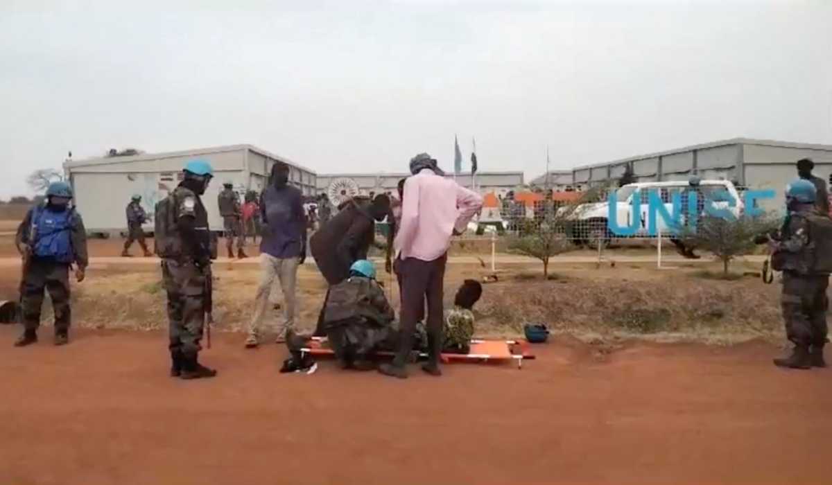 A person receives help as locals gather at a UN peacekeeper camp following deadly attacks, in Dokura, Abyei region, Sudan-South Sudan border area, in this still image obtained from a social media video released January 28, 2024. (REUTERS)