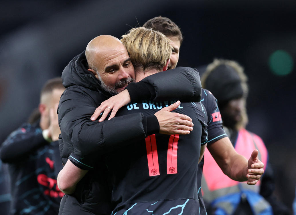 Manchester City manager Pep Guardiola celebrates with Kevin De Bruyne after thteir FA Cup - Fourth Round match against Tottenham Hotspur at Tottenham Hotspur Stadium on Jan. 26, 2024. (Reuters)