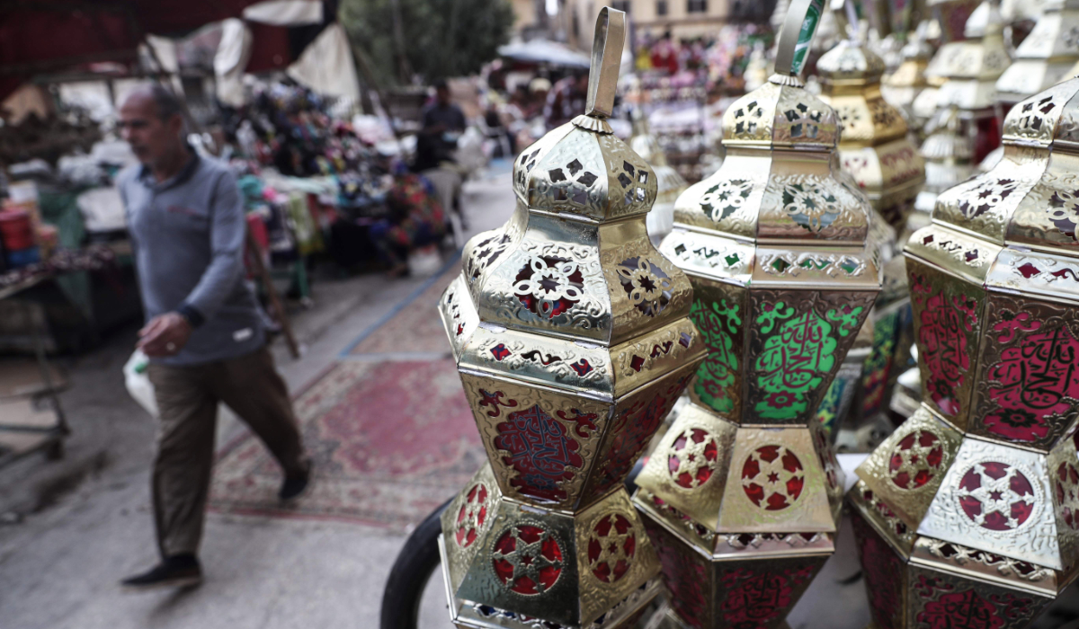 An Egyptian man walks past traditional lanterns known in Arabic as "Fanous" on display in Cairo's Sayeda Zainab neighbourhood ahead of the Muslim holy month of Ramadan, on April 17, 2020. (AFP file photo)