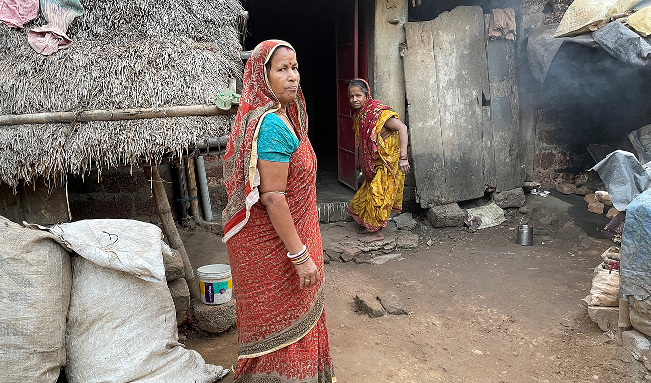 Tilottama Pradhan, a housewife, poses for a photograph outside her one-room house at Tarada village in Puri district of the eastern state of Odisha, India, December 15, 2023. (REUTERS)