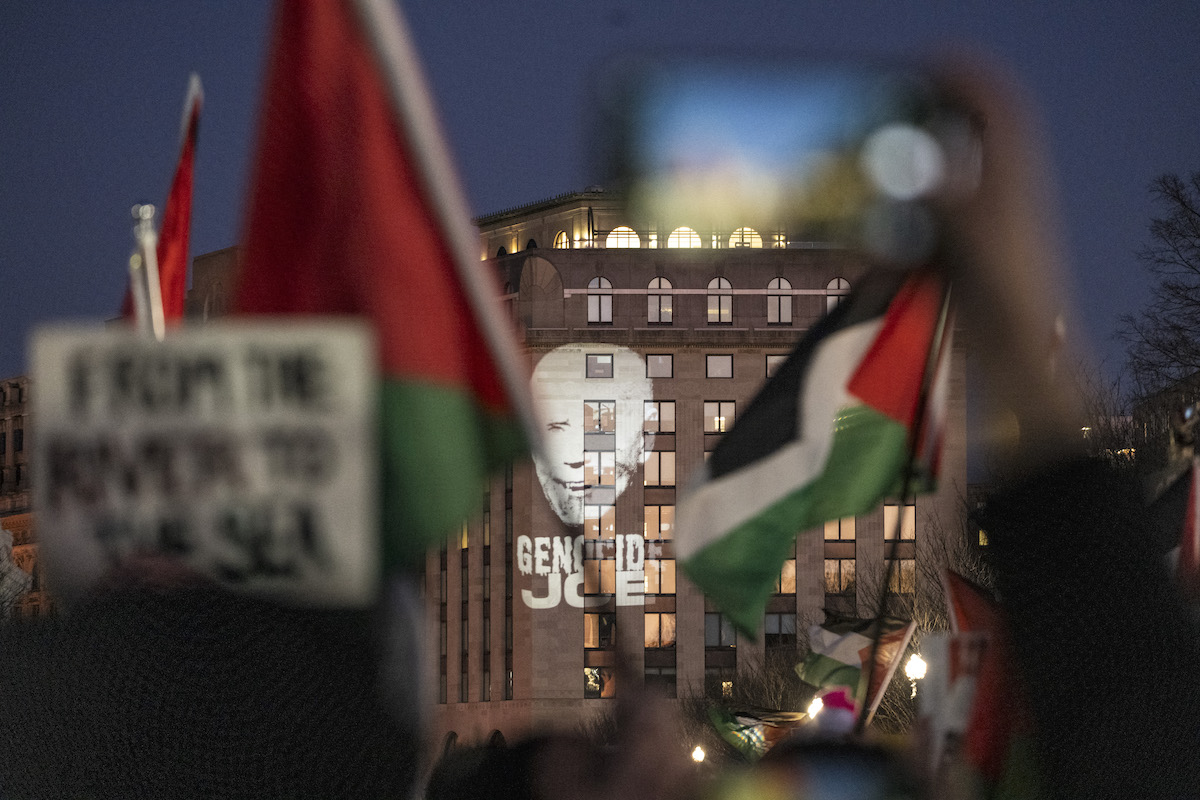 An image of US President Joe Biden is projected onto a building in the vicinity of the White House during the "March on Washington for Gaza" in Washington. (File/AFP)