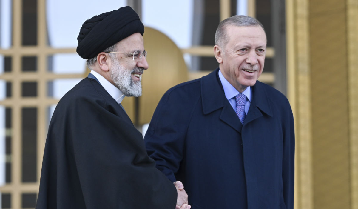 Turkish President Recep Tayyip Erdogan, right, shakes hands with Iranian President Ebrahim Raisi before their meeting in Ankara.