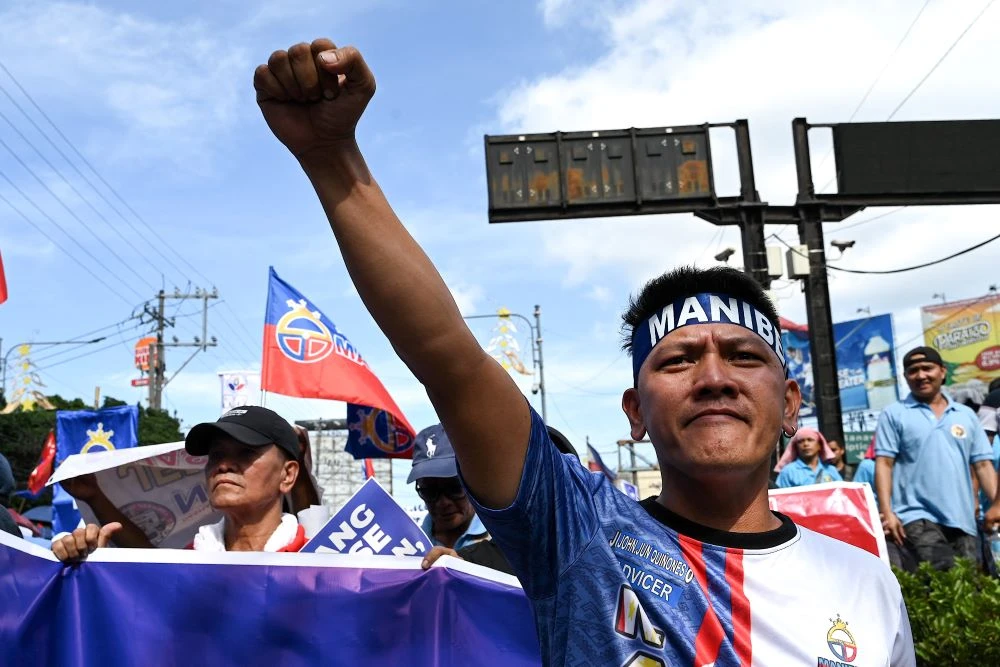 A driver takes part in a protest against a jeepney modernization plan in Manila, Philippines, Jan. 16, 2024. (AFP)