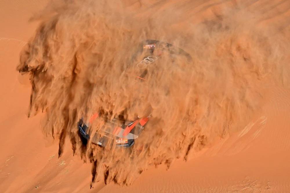 Team Audi Sport driver Carlos Sainz and co-driver Lucas Cruz during Stage 6 of Dakar Rally 2024, Shubaytah, Saudi Arabia, Jan. 11, 2024. (AFP)