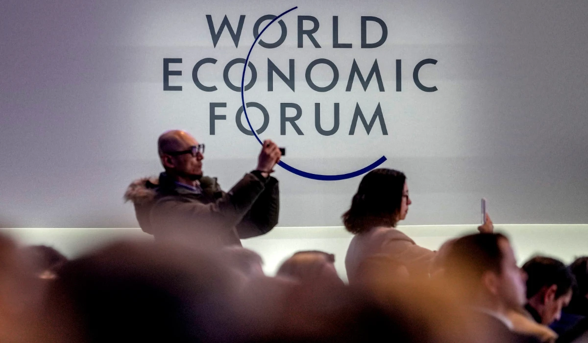 People take pictures on the last day of the forum's Annual Meeting in Davos, Switzerland, Friday, Jan. 19, 2024. (AP)