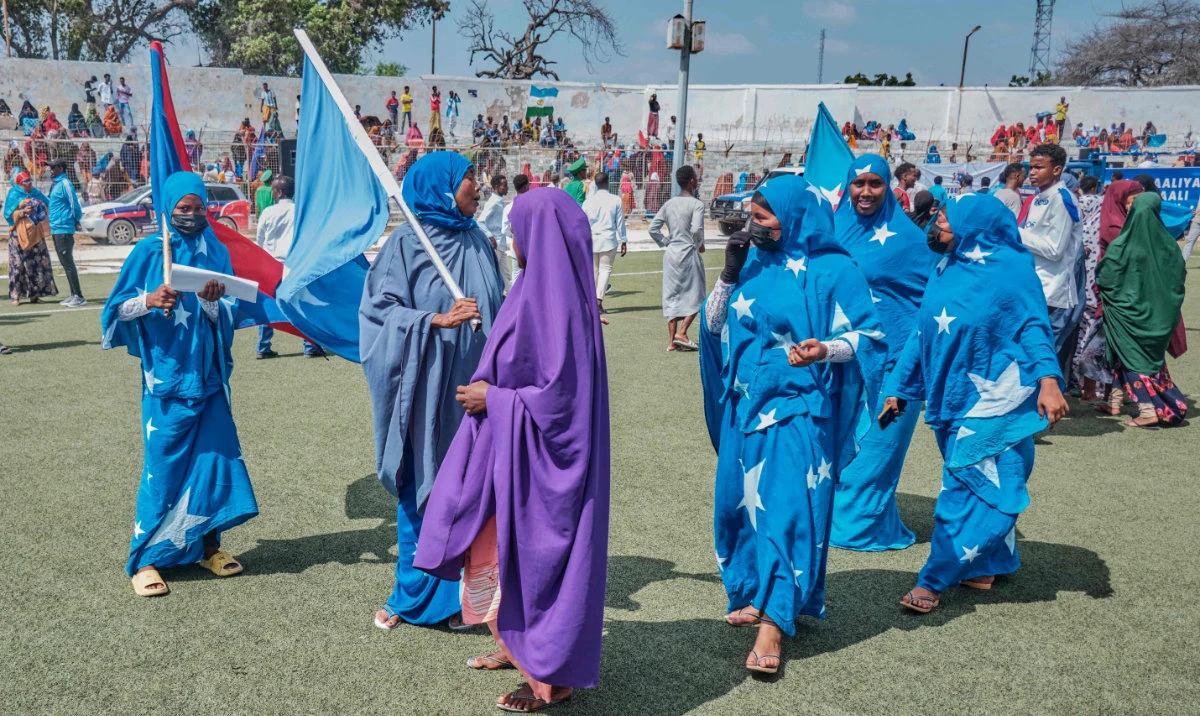 Girls dressed in the colors of the Somali flag participate in a demonstration supporting Somalia following the port deal signed between Ethiopia and the breakaway region of Somaliland, in Mogadishu on Thursday. (AFP)
