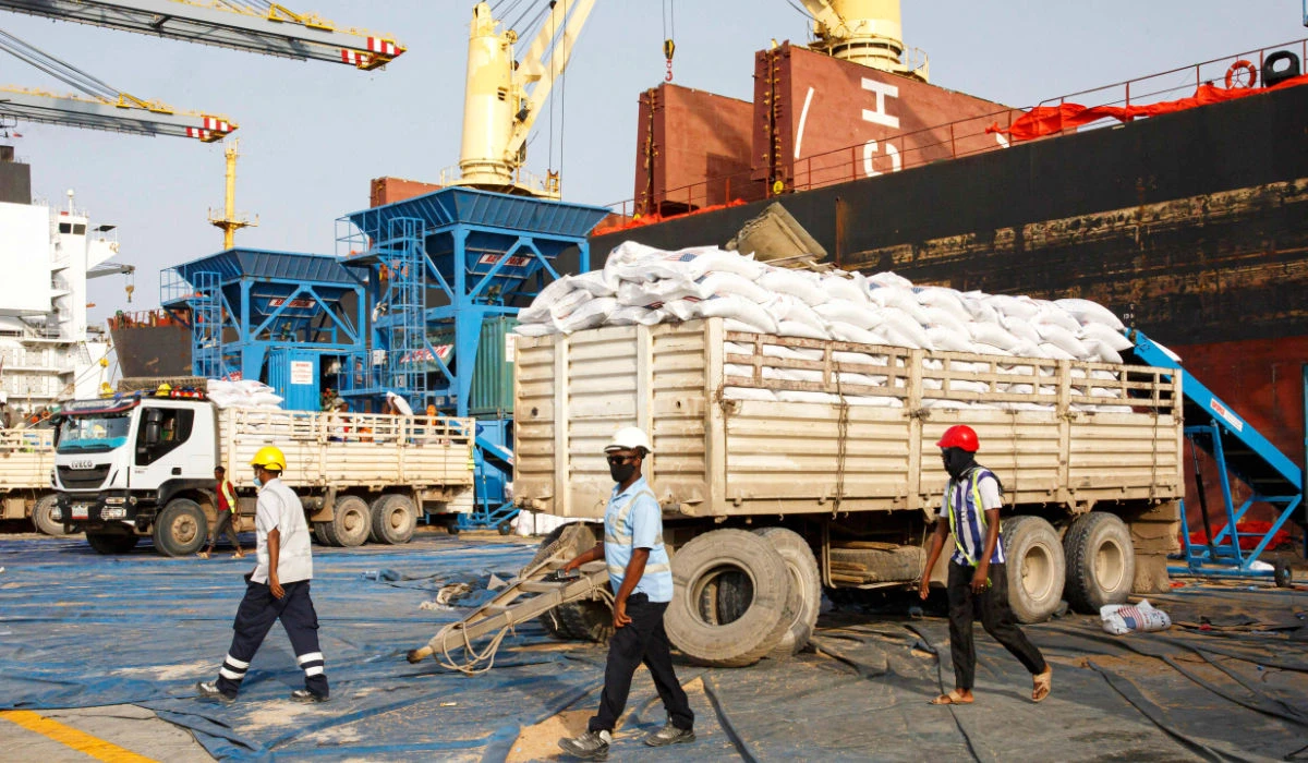 Grain from US Aid is unloaded from a ship and bagged at Berbera Port in Somaliland on August 31, 2021. (AFP)