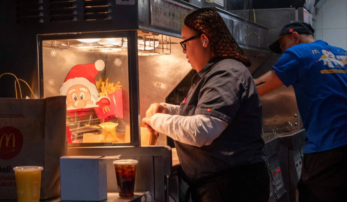 A woman works in a McDonalds in Manhattan on January 05, 2024 in New York City. (AFP)