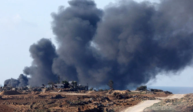 A picture taken from a position in southern Israel along the border with the Gaza Strip, shows smoke billowing over the Palestinian territory during Israeli bombardment on January 5, 2024, amid continuing battles between Israel and the militant group Hamas. (AFP)