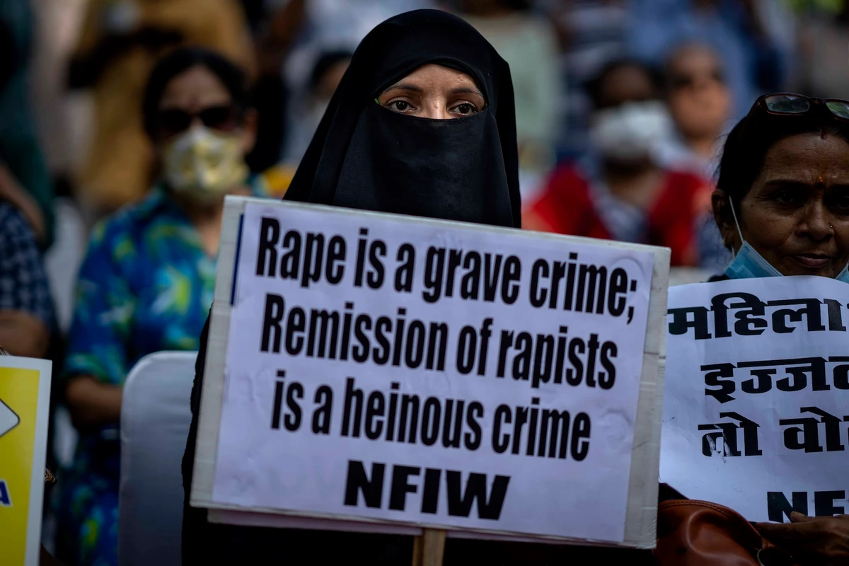 In this file photo, a woman holds a placard during a protest in New Delhi, India on Aug. 27, 2022. (AP)