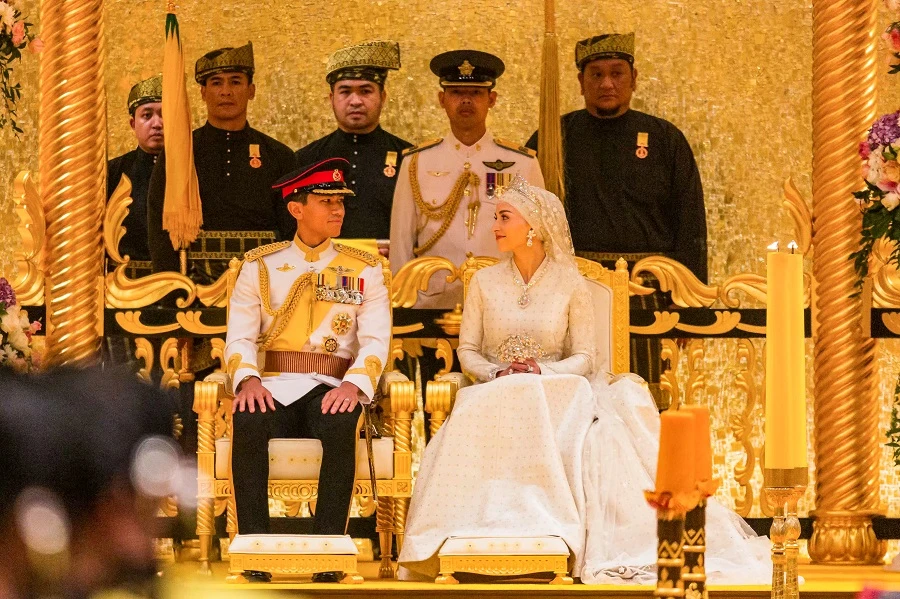 Prince Abdul Mateen and Yang Mulia Anisha Rosnah sit during their wedding reception. (AFP)