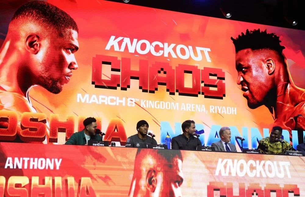 British heavyweight boxer Anthony Joshua, 2nd left, and French-Cameroonian boxer Francis Ngannou, right, attend a press conference in London on January 15, 2024, ahead of their fight in March. (AFP)