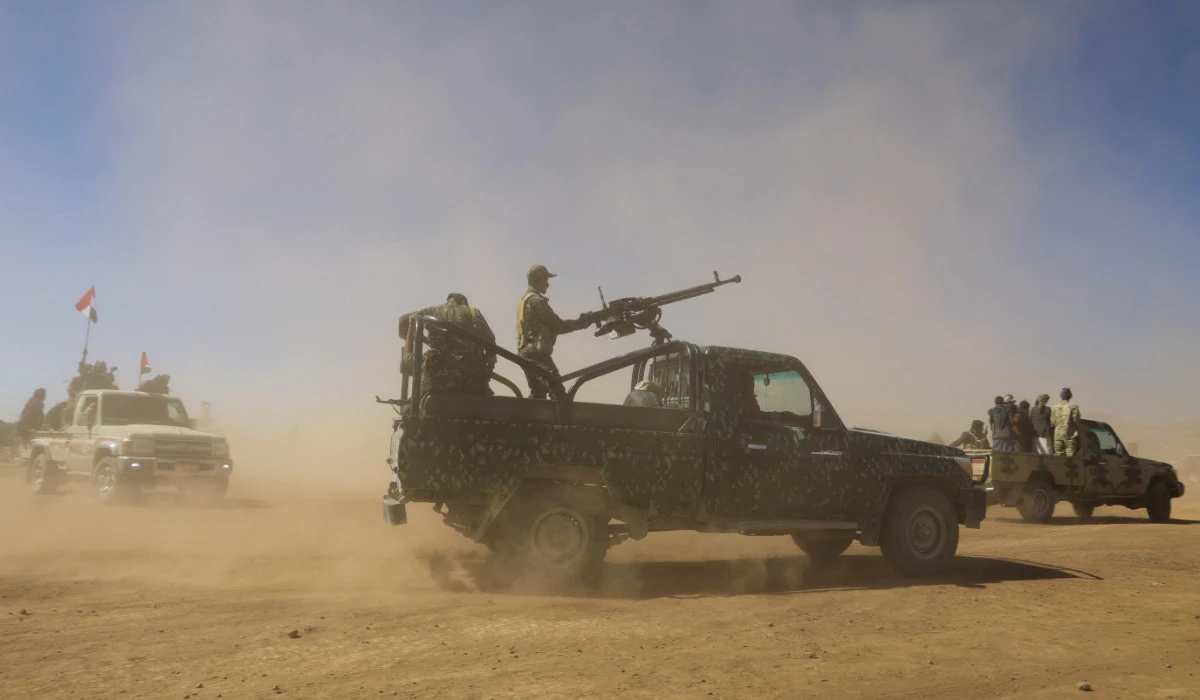 Pick-up trucks carrying Houthi policemen and tribal supporters of the group parade during a protest against recent US-led strikes on Houthi targets, near Sanaa, Yemen January 14, 2024. (REUTERS)