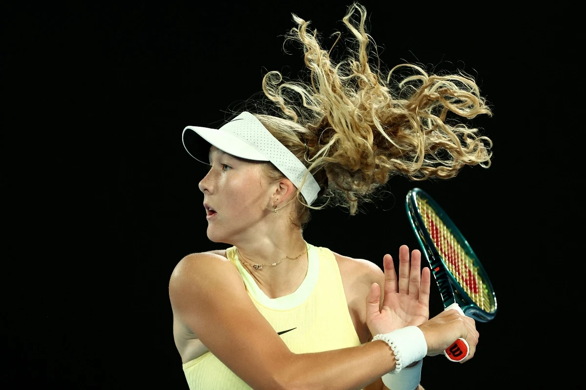 Russia's Mirra Andreeva serves against Tunisia's Ons Jabeur during their women's singles match on day four of the Australian Open tennis tournament in Melbourne on Jan. 17, 2024. (AFP)