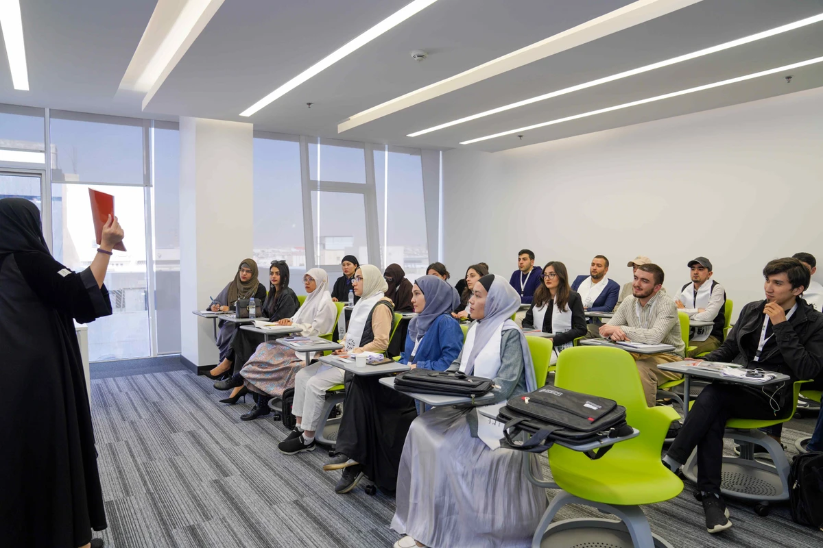 A female teaching member teaching the Arabic language in-person within the activities of ABJAD Center’s program to teach the Arabic language to speakers of other languages. (Supplied)