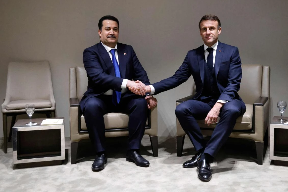 French President Emmanuel Macron shakes hands with Iraq's Prime Minister Mohammed Shia al-Sudani during a bilateral meeting at the World Economic Forum (WEF) meeting in Davos on January 17, 2024. (File/AFP)