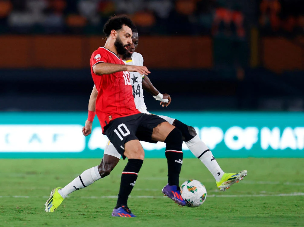 Egypt’s Mohamed Salah in action with Ghana’s Gideon Mensah during their Africa Cup of Nations — Group B — match at Felix Houphouet Boigny Stadium, Abidjan on Jan. 18, 2024. (Reuters)