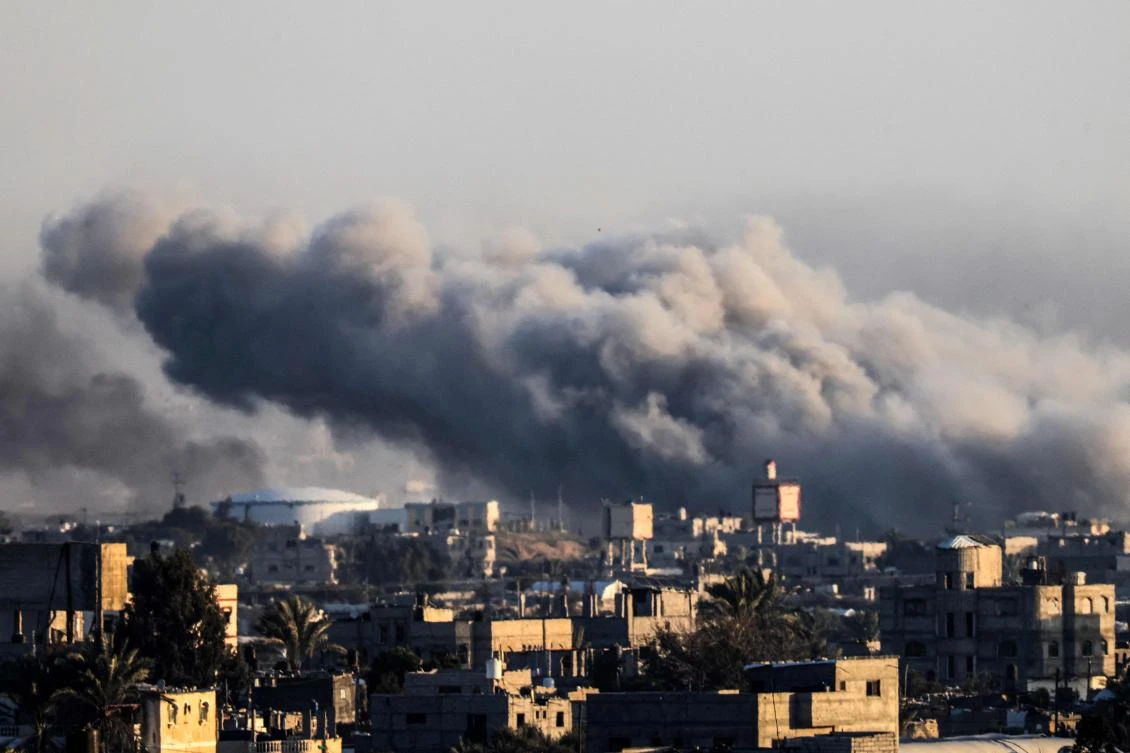 This photograph taken on January 22, 2024 from Rafah, shows smoke billowing during Israeli bombardment over Khan Yunis in the southern Gaza Strip, amid ongoing battles between Israel and the Palestinian militant group Hamas. (AFP)
