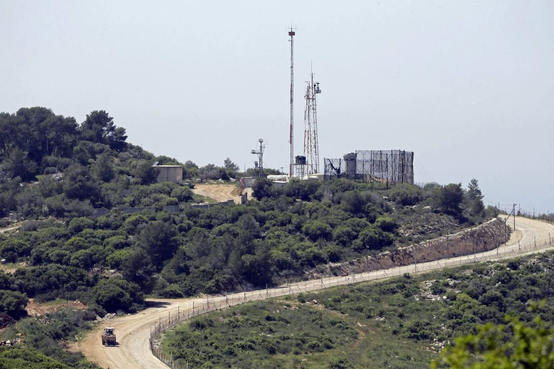 A picture taken from Naqoura in southern Lebanon shows an Israeli observation station along the border near Kibbutz Hanita on April 20, 2017. (AFP)