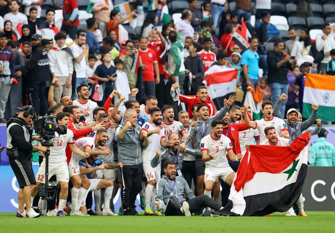 Syria players celebrate after their AFC Asian Cup — Group B — match against India at Al Bayt Stadium, Al Khor, Qatar on Jan., 23, 2024. (Reuters)