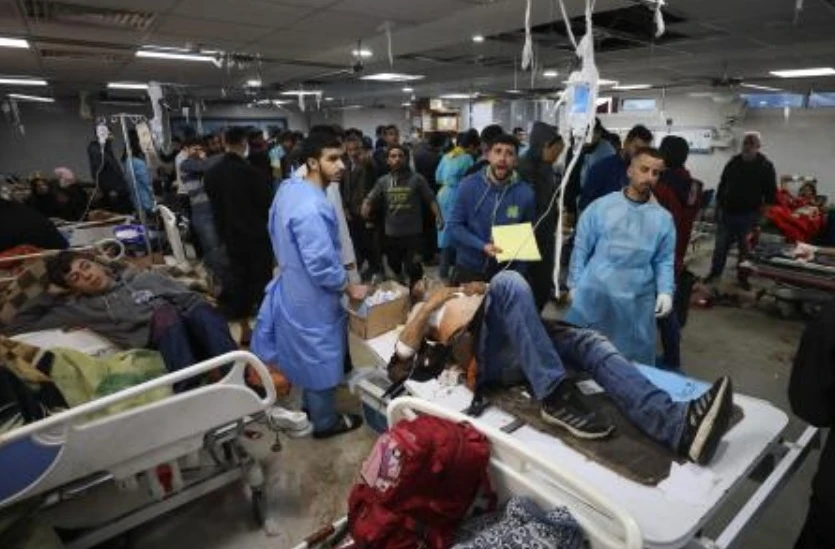 Injured people receive treatment in Gaza City’s Al-Shifa hospital, following a reported Israeli strike, that according to Gaza’s Health Ministry, killed at least 20 and wounded more than 150 as they waited for humanitarian aid, on Jan. 25, 2024. (AFP)