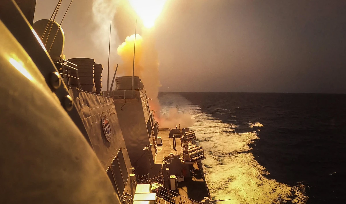This handout picture courtesy of the US Navy taken on October 19, 2023 shows the Arleigh Burke-class guided-missile destroyer USS Carney (DDG 64) defeating a combination of Houthi missiles and unmanned aerial vehicles in the Red Sea. (AFP/File)