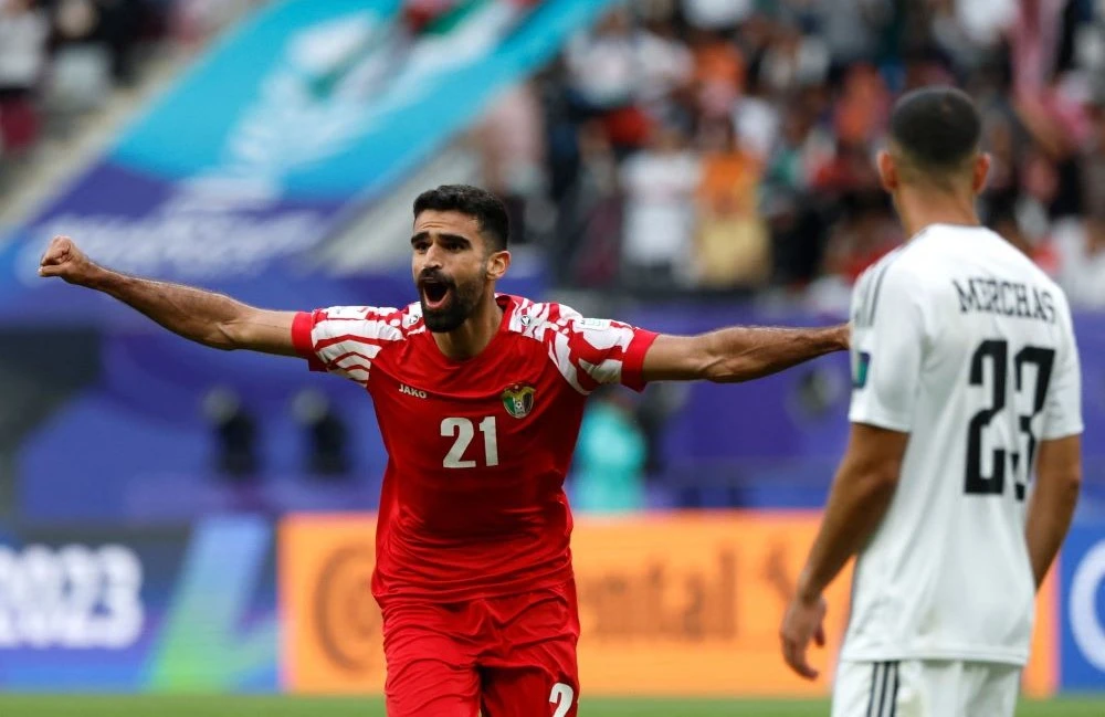 Jordan’s midfielder Nizar Al-Rashdan celebrates scoring the winner against Iraq at Khalifa International Stadium in Doha, Qatar, Jan. 29, 2024. (AFP)