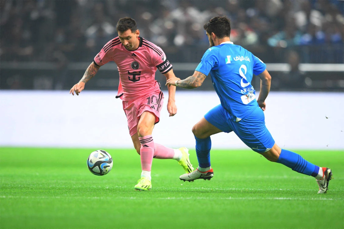 Inter Miami forward Lionel Messi, left plays the ball defend by Al-Hilal midfielder Ruben Neves during their friendly match in Riyadh on Monday. (USA TODAY Sports)
