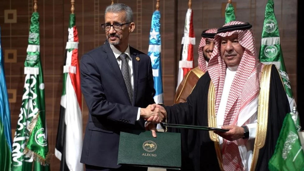 The agreement was signed by the Supervisor General of King Abdulaziz Public Library (KAPL) Faisal bin Muammar, right, and the Director-General of ALECSO Mohamed Ould Amar. (Supplied)