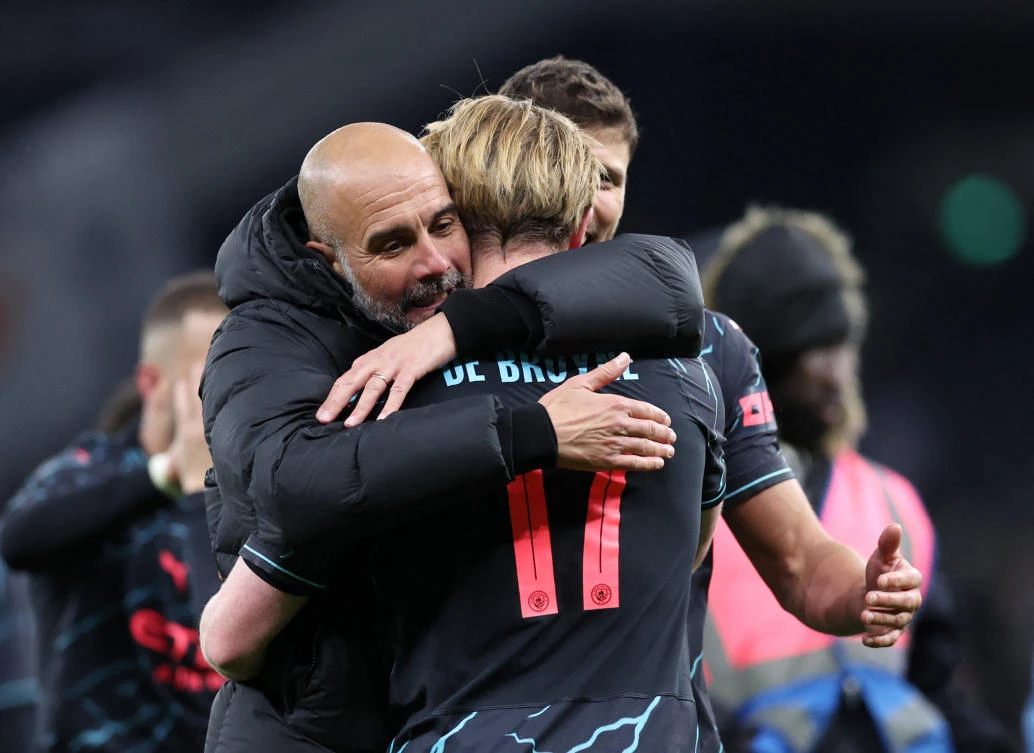 Manchester City manager Pep Guardiola celebrates with Kevin De Bruyne after thteir FA Cup - Fourth Round match against Tottenham Hotspur at Tottenham Hotspur Stadium on Jan. 26, 2024. (Reuters)