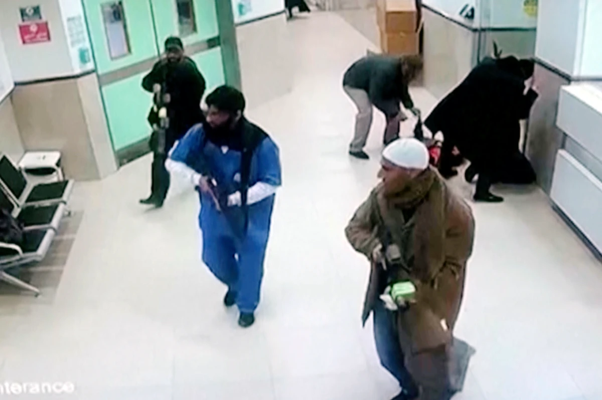 Israeli forces disguised as civilians and medical workers hold weapons in a hallway at the Ibn Sina Hospital in the West Bank town of Jenin, Tuesday, jan 30, 2024. (AP)