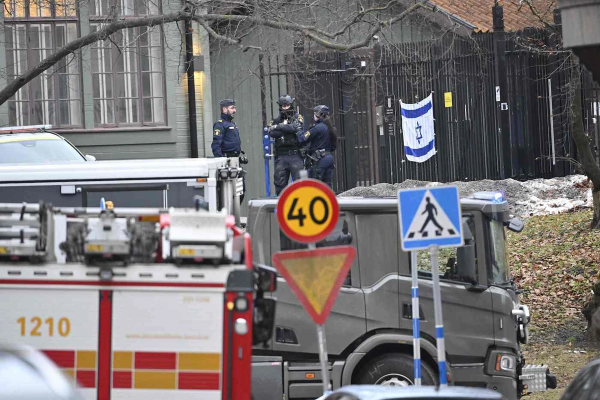 Police officers are seen outside the Israeli embassy in Stockholm, January 31, 2024. (AFP)