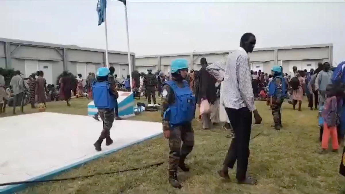 Locals gather at a UN peacekeeper camp following deadly attacks, in Dokura, Abyei region, Sudan-South Sudan border area, in this still image obtained from a social media video released Jan. 28, 2024. (Reuters)