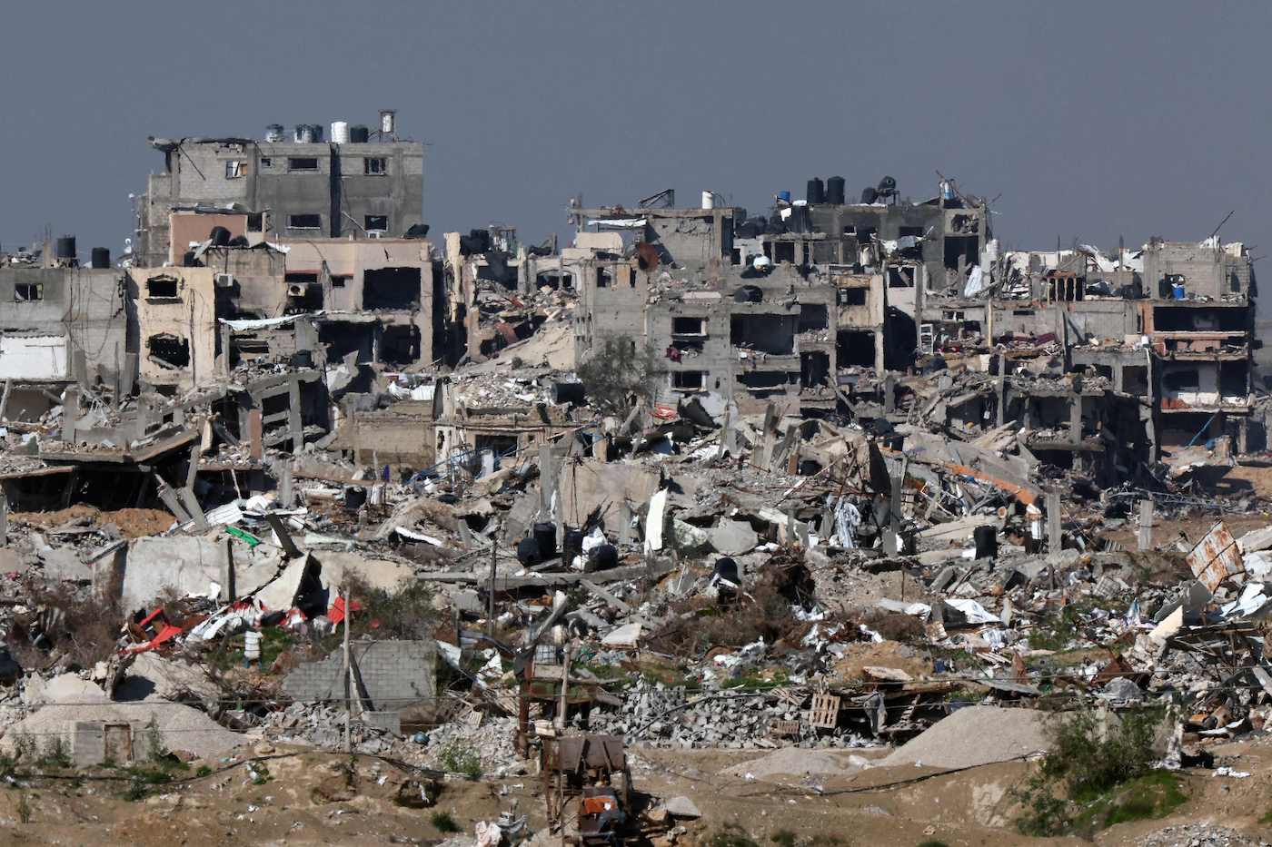 A picture taken from southern Israel shows destroyed buildings in the Gaza Strip on February 7, 2024. (AFP)