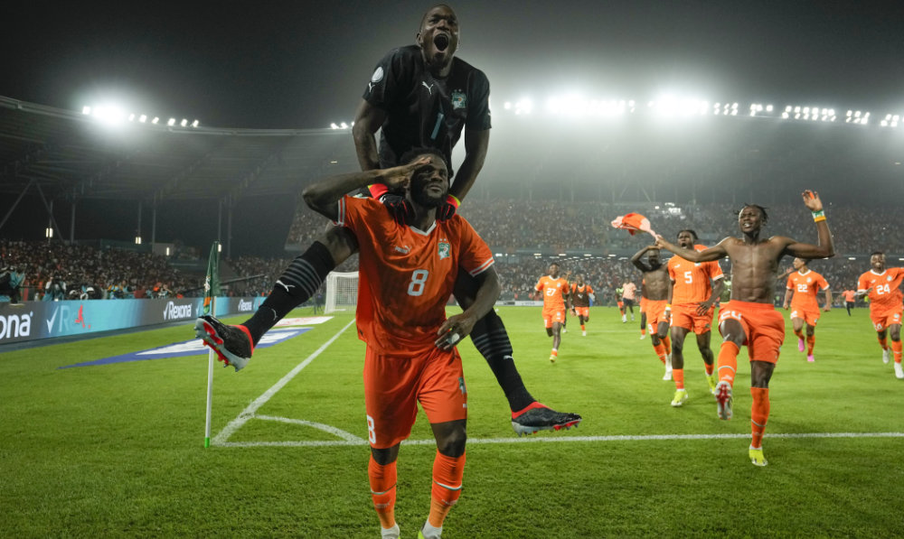 Ivory Coast's Franck Kessie, bottom, celebrates after defeating Senegal in a penalty shootout during their African Cup of Nations round of 16 soccer match between Senegal and Ivory Coast, at the Charles Konan Banny stadium in Yamoussoukro, Ivory Coast, on Jan. 20, 2024. (AP)