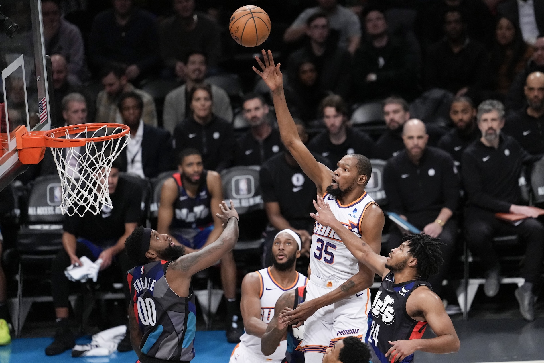 Phoenix Suns forward Kevin Durant goes to the basket against Brooklyn Nets guard Cam Thomas (24) and forward Royce O'Neale (00) during the second half of an NBA basketball game Wednesday in New York. The Suns won 136-120. (AP)