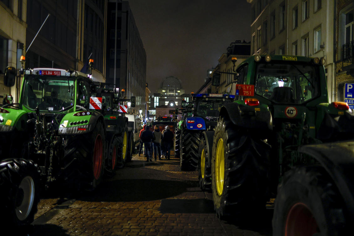 Tractors are parked as farmers gather for a protest outside the European Parliament ahead of an EU summit in Brussels on Feb. 1, 2024. (AP)