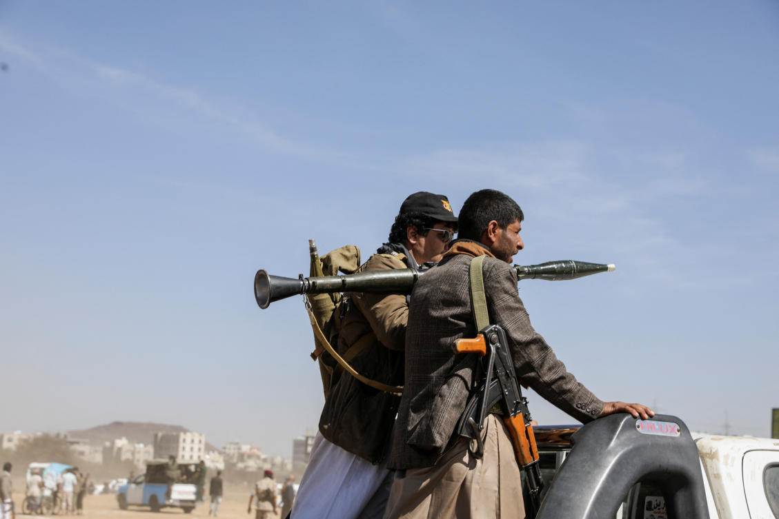 Armed Houthi followers ride on the back of a pick-up truck during a parade in solidarity with the Palestinians in the Gaza Strip and to show support to Houthi strikes on ships in the Red Sea and the Gulf of Aden (REUTERS)