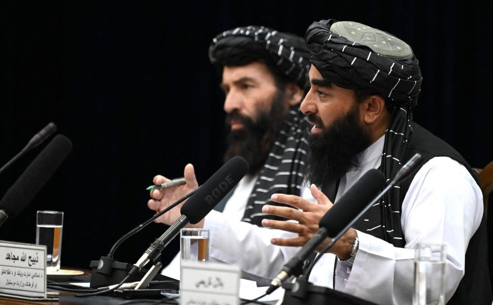 Taliban spokesman Zabihullah Mujahid, right, speaks during a press conference in Kabul, Afghanistan, June 30, 2022. (AFP)