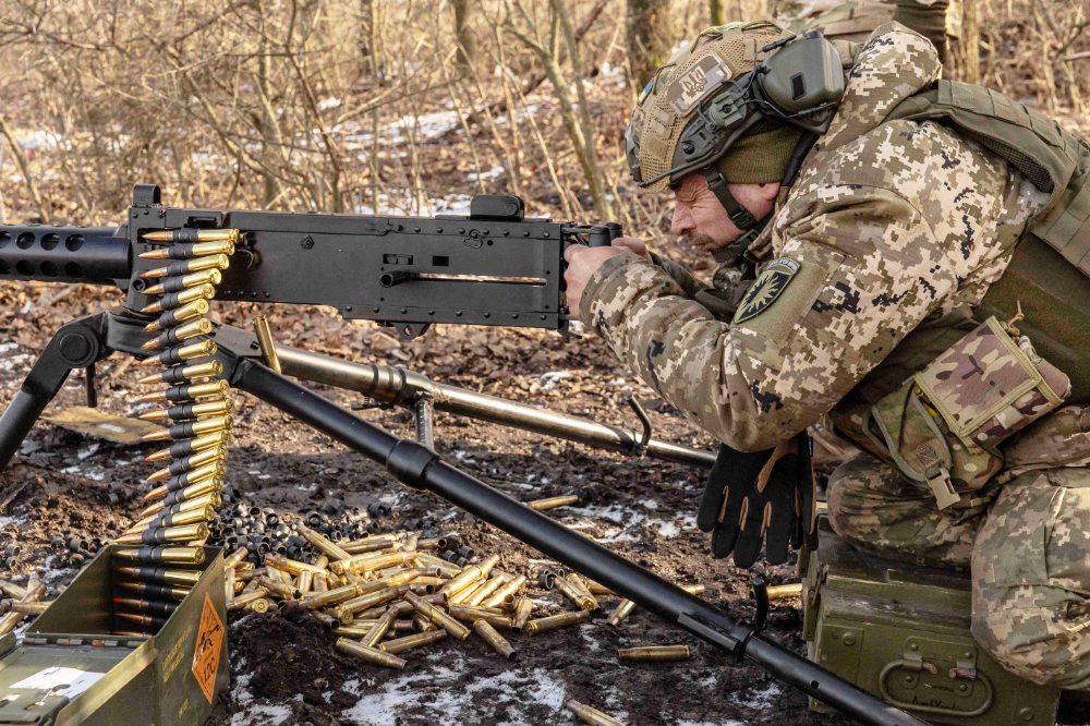 A Ukrainian serviceman of the 22nd Mechanized Brigade shoots with M2 Browning during a military training in the Donetsk region, on January 31, 2024, amid the Russian invasion of Ukraine. (AFP)