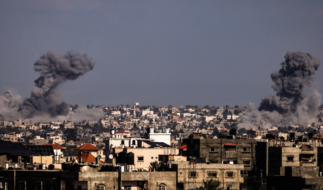 This picture taken from Rafah, in the southern Gaza Strip, shows smoke rising over buildings in Khan Yunis during Israeli bombardment on February 1, 2024. (AFP)