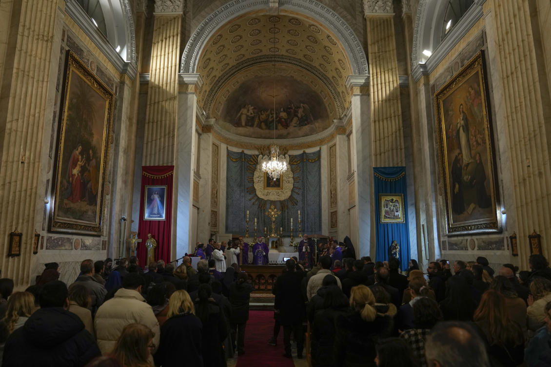 Worshipers attend a mass ceremony in the attacked Roman Catholic church in Istanbul. The Daesh group has claimed responsibility for an attack on a Roman Catholic church in Istanbul during a Sunday Mass that killed one person. (AP)