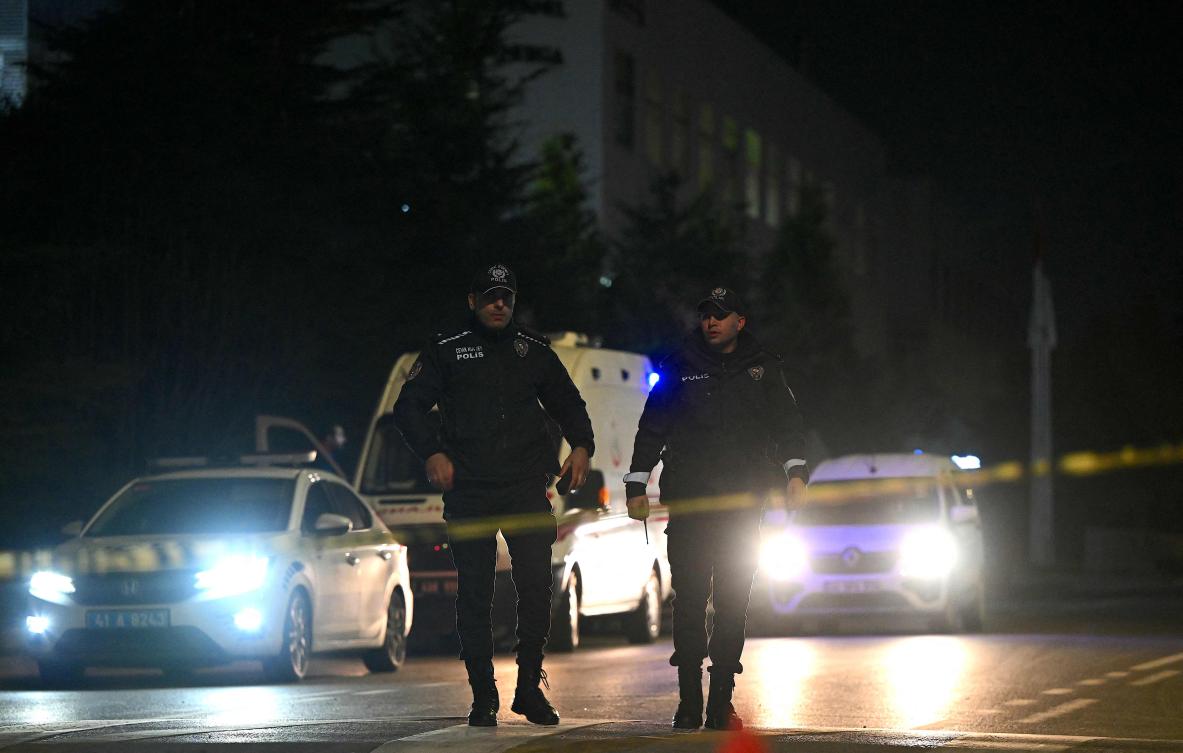 Turkish police officers block the street where a plant owned by US giant Procter & Gamble is located at Gebze District in Kocaeli near Istanbul on February 1, 2024, after an assailant took an undisclosed number of people hostage. (AFP)