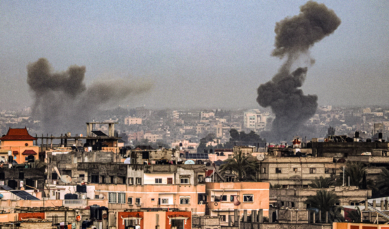 A picture taken from Rafah in the southern Gaza Strip shows smoke rising over buildings in Khan Yunis during Israeli bombardment on February 2, 2024, as fighting continues between Israel and the Palestinian Hamas group. (AFP/File)
