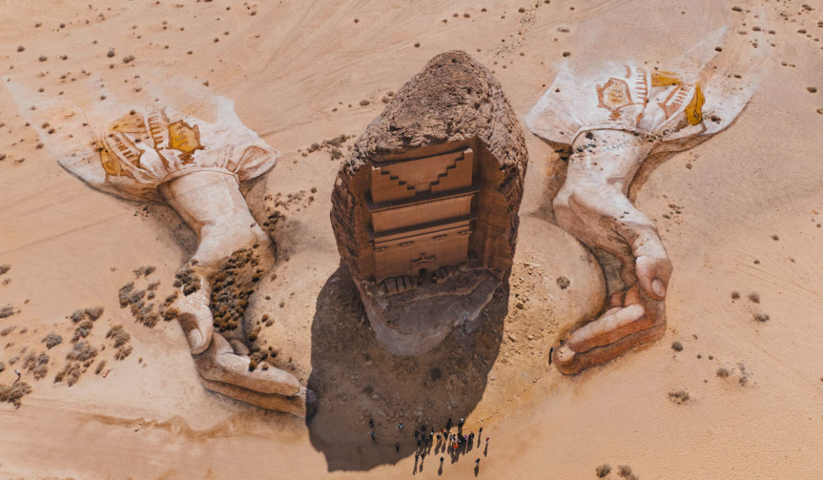Royal Commission for Alula has partnered with American land artist David Popa to create an artwork featuring two giant hands emerging from the sands and cradling the iconic tomb of Lihyan son of Kuza. (Supplied)